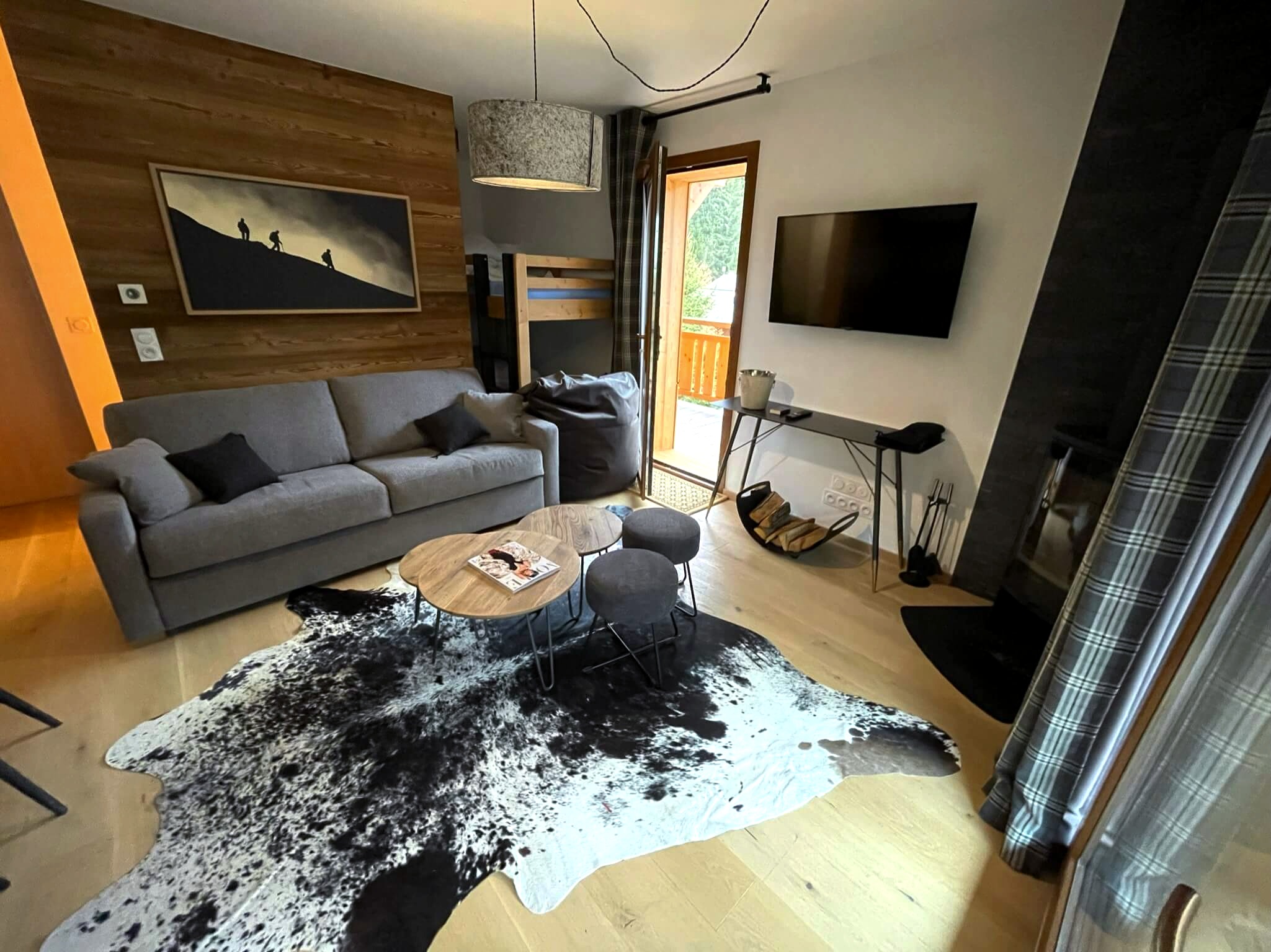Stylish living room with a TV and log burner